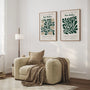 Set of 2 green leaf posters styled in modern living room with natural decor